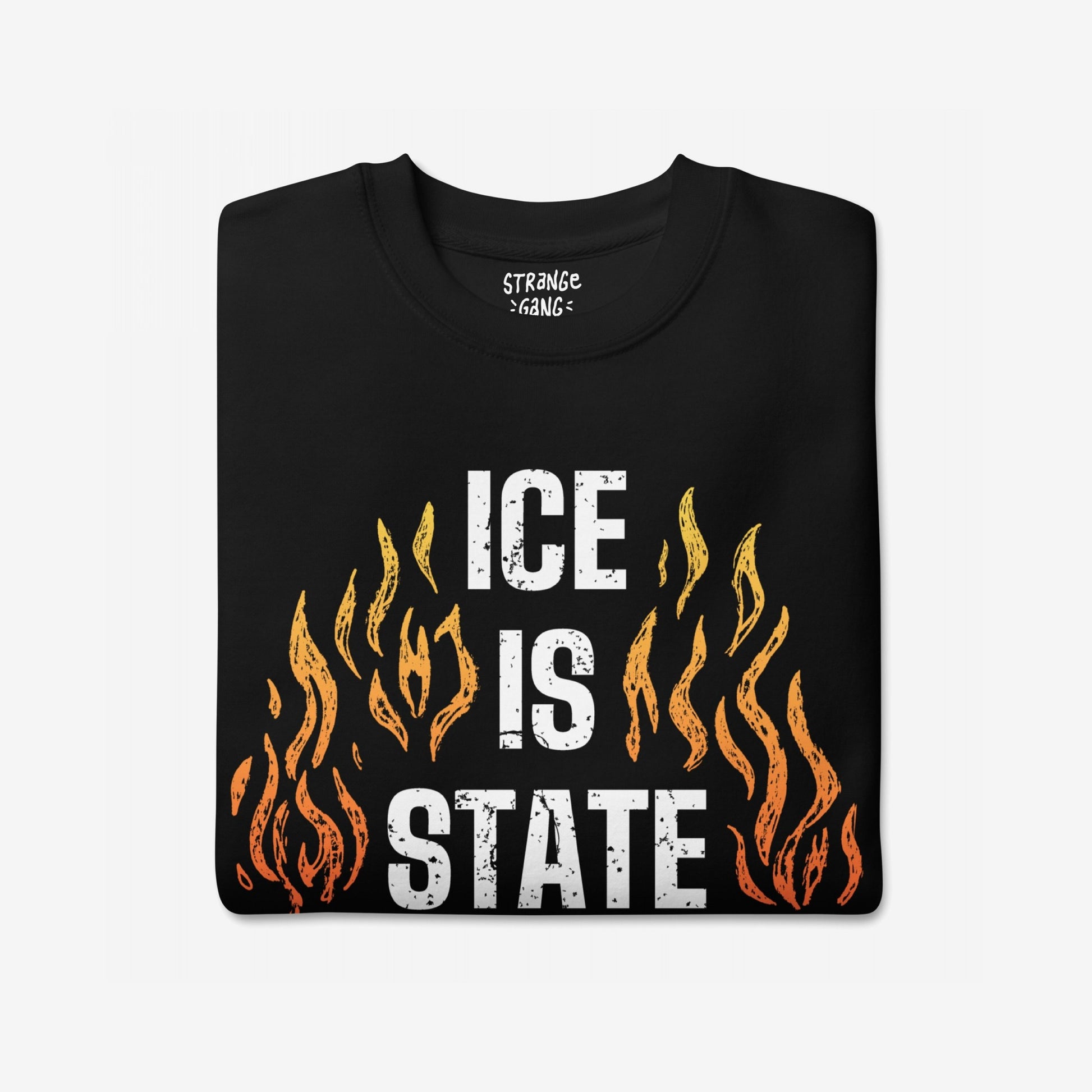ICE Is State Sponsored Terrorism T-shirt with bold white letters and orange-yellow flames, symbolizing resistance and advocacy for immigrant justice and abolition.