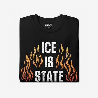 ICE Is State Sponsored Terrorism T-shirt with bold white letters and orange-yellow flames, symbolizing resistance and advocacy for immigrant justice and abolition.