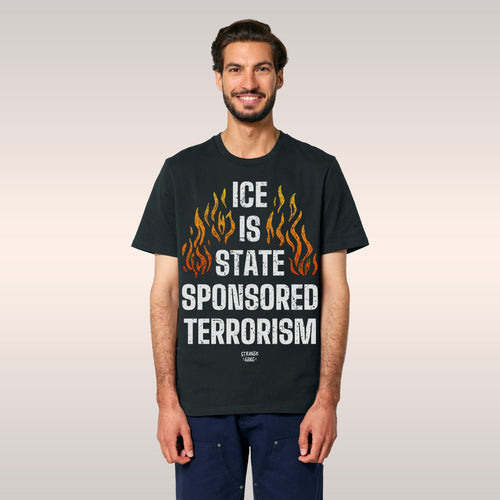 Two individuals wear the ICE Is State Sponsored Terrorism Shirt, displaying the slogan in bold letters and orange flames, hig