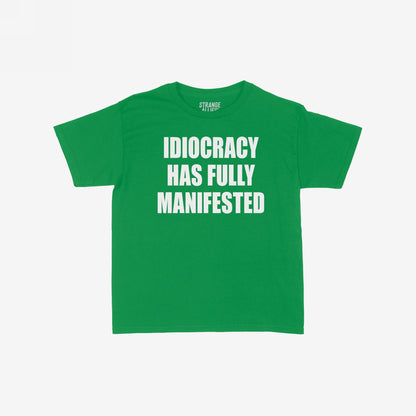 The Idiocracy Women's Baby Tee features bold white text declaring “IDIOCRACY HAS FULLY MANIFESTED.”, capturing societal satire with its cropped design, perfect for making a statement.