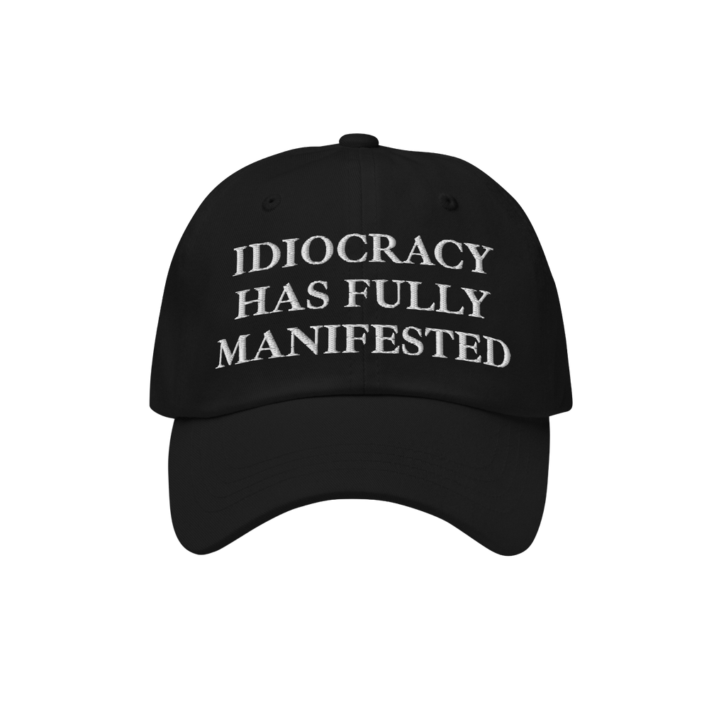 Black baseball-style cap featuring the bold embroidered text IDIOCRACY HAS FULLY MANIFESTED in classic serif type, blending s