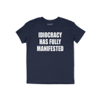 The Idiocracy T-shirt features a bold white slogan declaring “IDIOCRACY HAS FULLY MANIFESTED,” capturing the essence of m