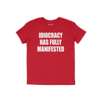 Red T-shirt with bold white text: IDIOCRACY HAS FULLY MANIFESTED. The Idiocracy T-shirt delivers a stark message, suited for