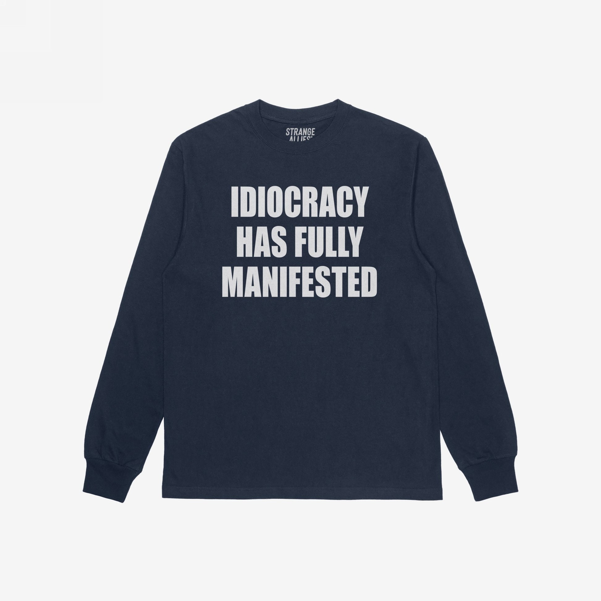 Navy-blue Idiocracy T-shirt with “IDIOCRACY HAS FULLY MANIFESTED.” printed in white on the front, reflecting a bold, political statement.