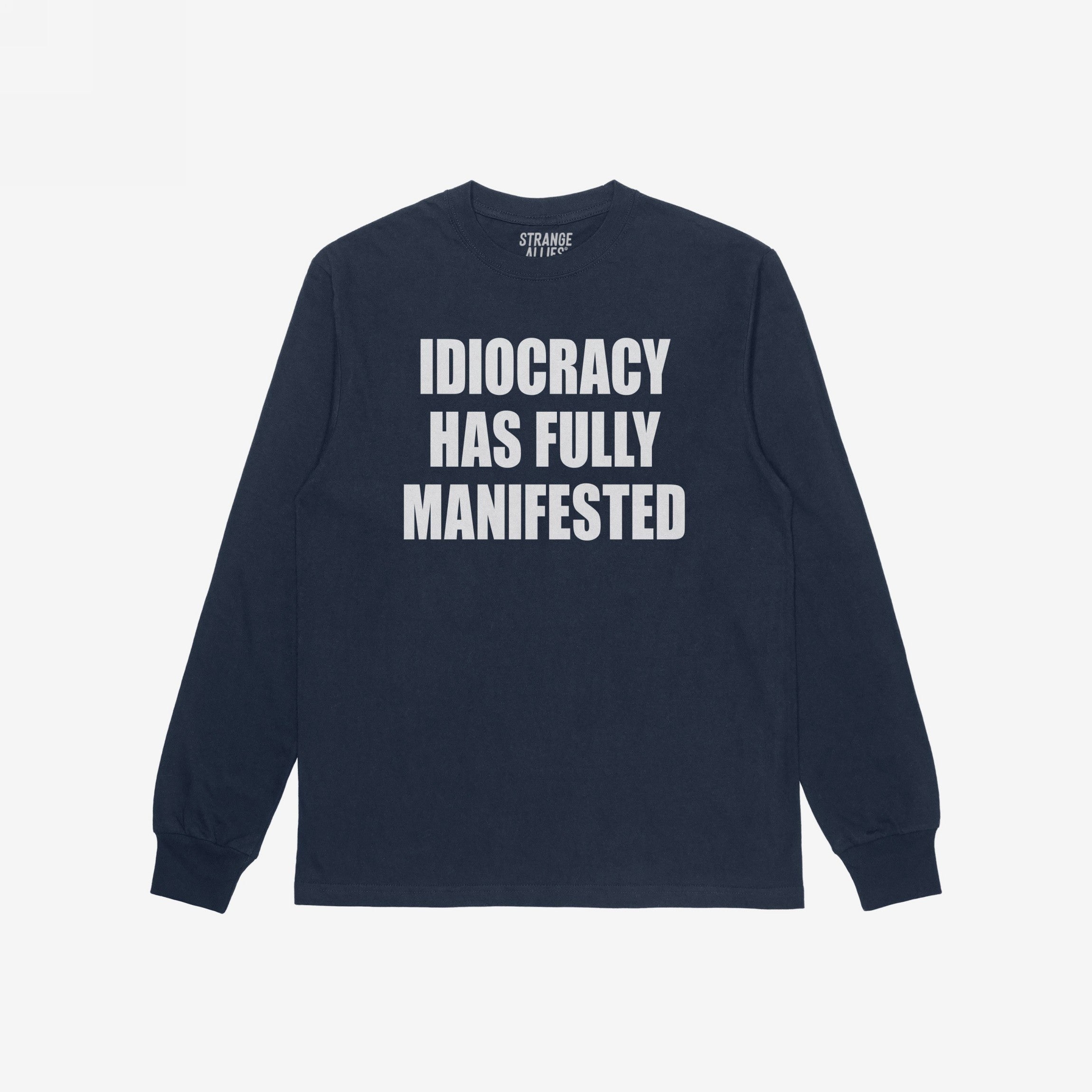 Navy-blue Idiocracy T-shirt with “IDIOCRACY HAS FULLY MANIFESTED.” printed in white on the front, reflecting a bold, political statement.