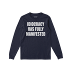 Navy-blue Idiocracy T-shirt with “IDIOCRACY HAS FULLY MANIFESTED.” printed in white on the front, reflecting a bold, poli