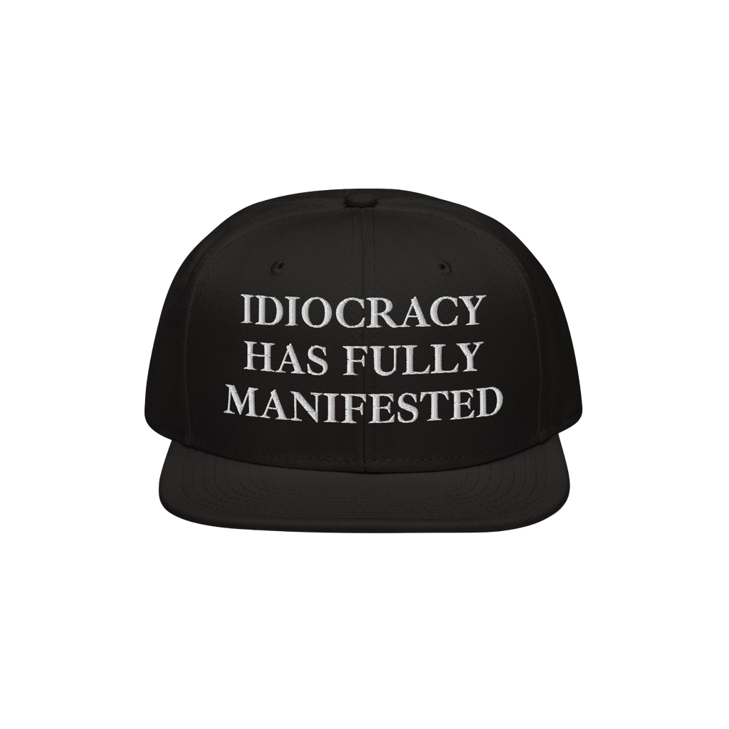Black snap-back baseball cap with white serif text: “IDIOCRACY HAS FULLY MANIFESTED.” The Idiocracy Hat delivers bold soc