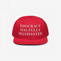 Bright-red Idiocracy Hat with white embroidered text, IDIOCRACY HAS FULLY MANIFESTED, in classic serif type, ideal for those expressing bold social commentary.
