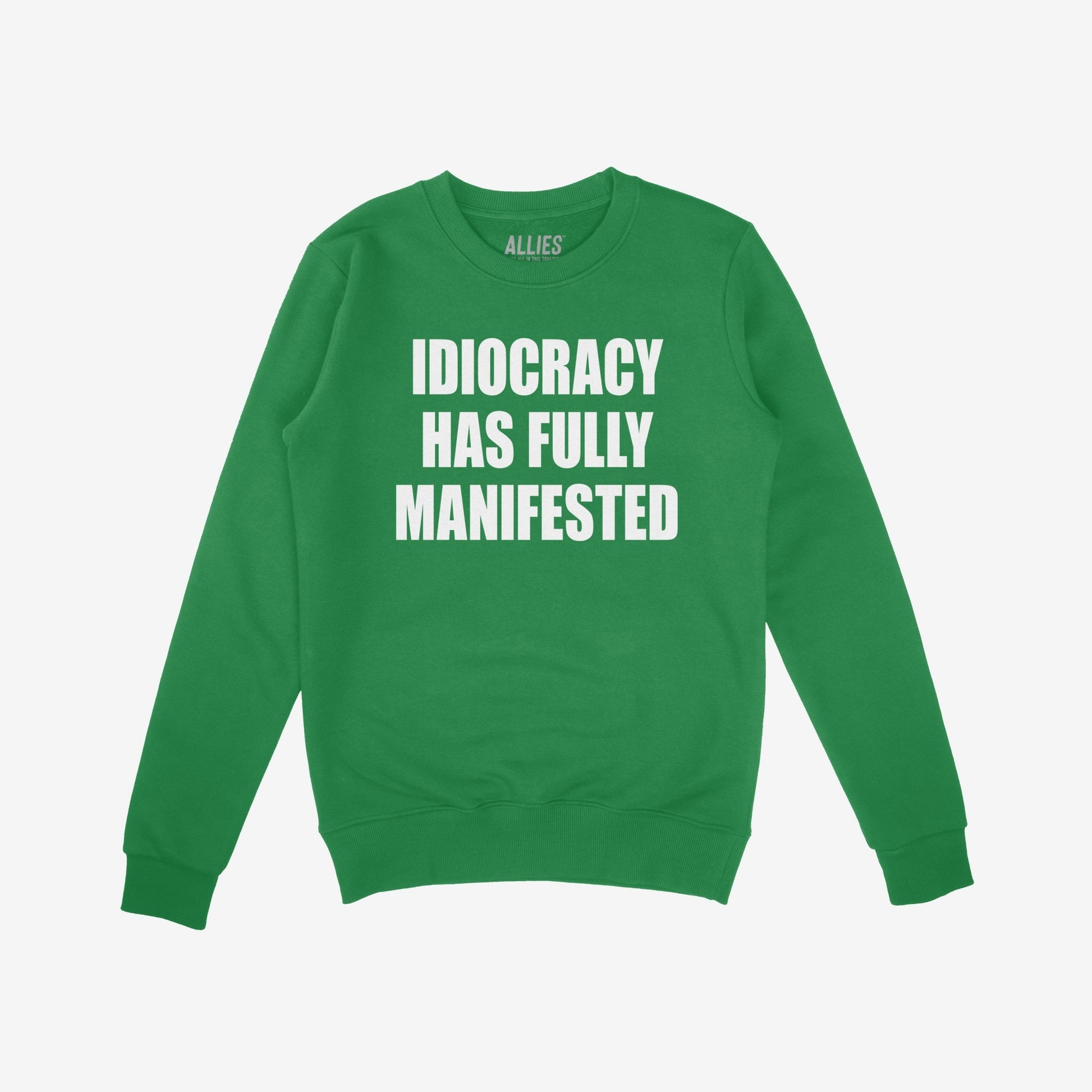 Idiocracy Sweatshirt featuring bold white text, IDIOCRACY HAS FULLY MANIFESTED, on a green crewneck. Label reads “ALLIES.” A statement piece for those challenging modern politics.
