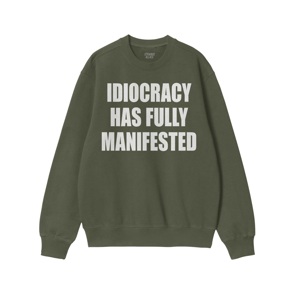 Idiocracy Sweatshirt featuring bold white text, IDIOCRACY HAS FULLY MANIFESTED, on a green crewneck. Label reads “ALLIES.��