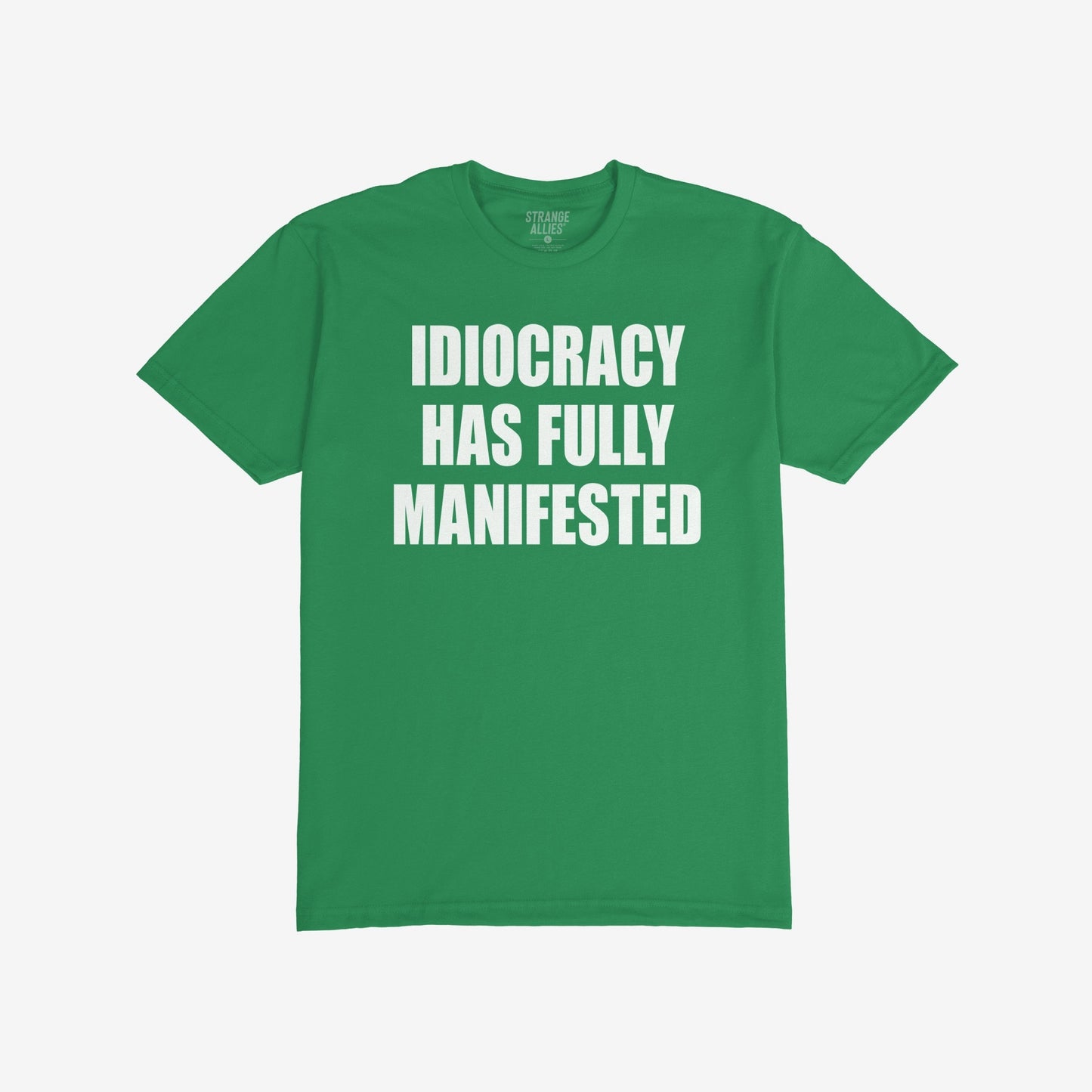 Green, short-sleeved Idiocracy T-shirt features bold white text stating “IDIOCRACY HAS FULLY MANIFESTED”, reflecting a satirical take on current events, ideal for the politically disillusioned and meme enthusiasts.