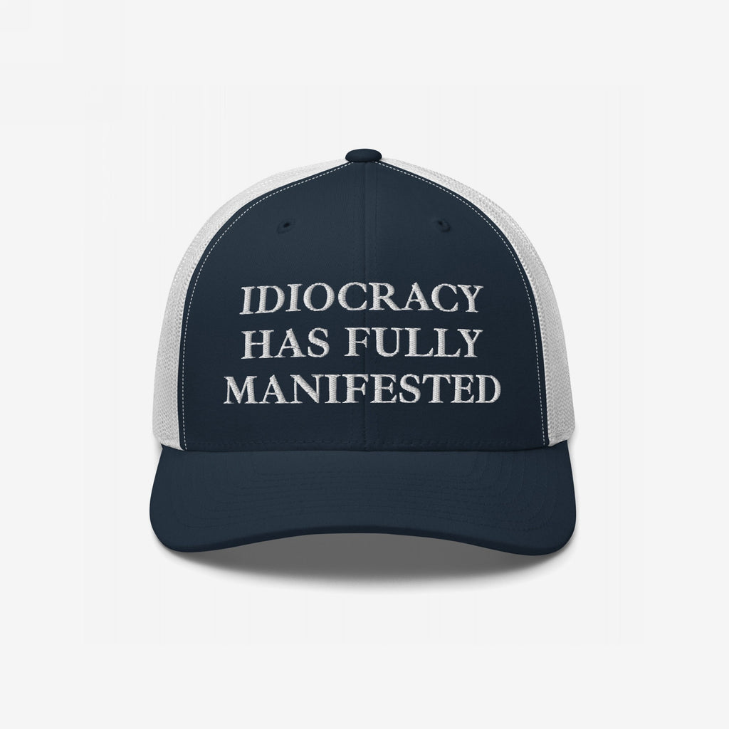 Navy-blue and white trucker-style cap with “IDIOCRACY HAS FULLY MANIFESTED” embroidered on the front, reflecting social commentary. Ideal for those who embrace bold statements with the Idiocracy Hat.