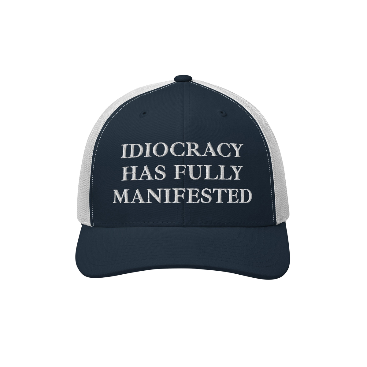 Navy-blue and white trucker-style cap with “IDIOCRACY HAS FULLY MANIFESTED” embroidered on the front, reflecting social c