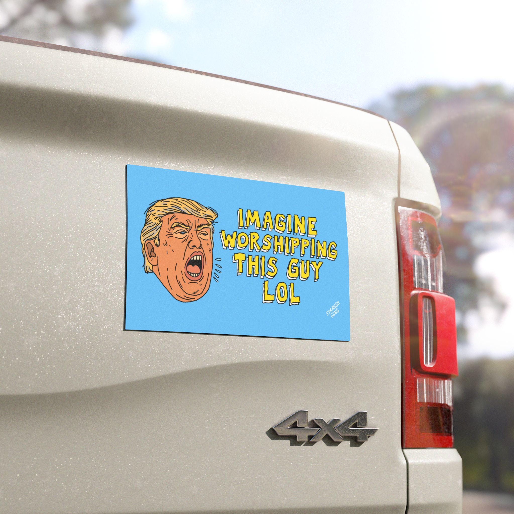 The Anti Trump LOL Magnet & Sticker on a white truck tailgate features a cartoon man yelling beside bold text mocking cult worship, embodying progressive satire and all-weather durability.