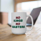 White ceramic No Kings No Masters Mug on a wooden tabletop, featuring bold hand-drawn text in contrasting colors. A laptop sits blurred in the background, suggesting a workspace setup.