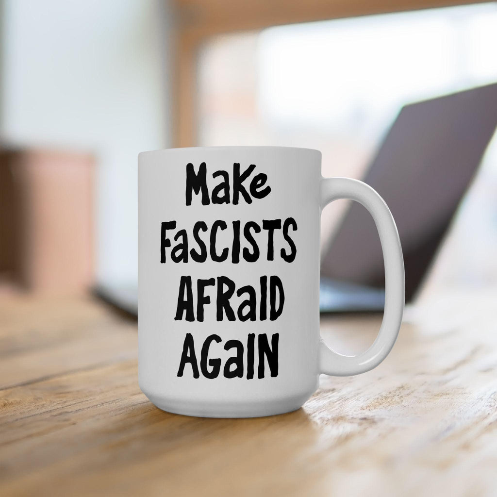 White ceramic mug with bold black text: “Make Fascists Afraid Again.” Perfect for energizing resistance and activism. Durable, lead-free, available in two sizes. Supports ACLU with proceeds.