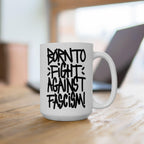 Born To Fight Against Fascism Graffiti Mug on a wooden table, showcasing bold hand-lettered text, blending protest art with functionality; ideal for activists, supporting equality and resistance.