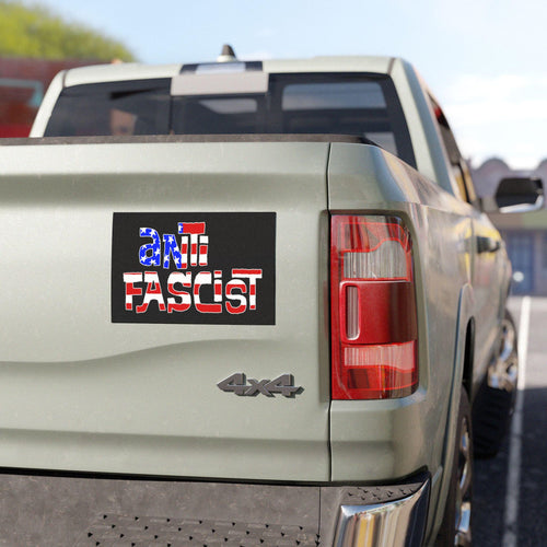 Anti Fascist USA Sticker & Magnet on a light-colored 4x4 truck's tailgate. The sticker features anti-FASCIST text with a stylized U.S. flag pattern, emphasizing resistance and patriotism.