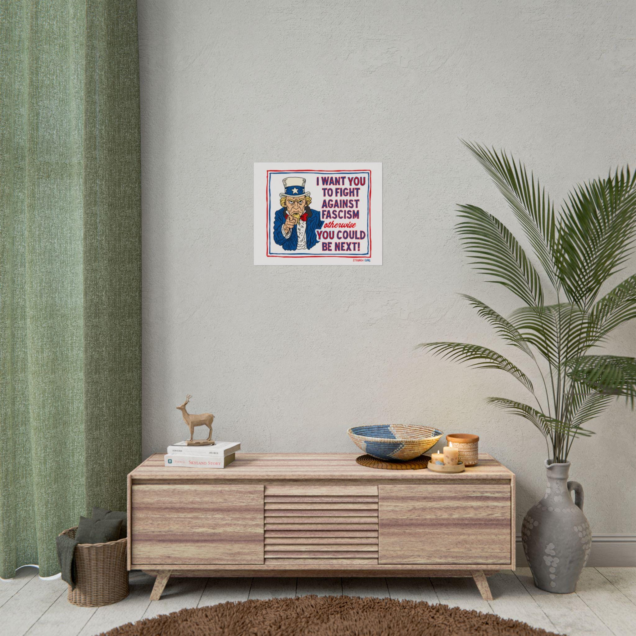 Anti Fascist Uncle Sam Poster in a modern-rustic room, displayed above a sideboard with candles, a deer figurine, and a woven bowl, conveying a bold message against authoritarianism.