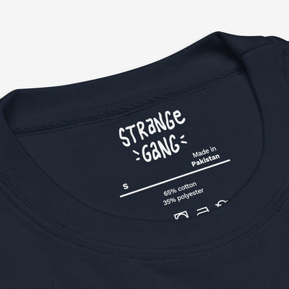 Inside back neckline of a navy T-shirt showing brand details, size S, and care instructions. The Chicago Gadsden Flag Hoodie & Sweatshirt features protest-inspired urban pride, emphasizing Chicago's resistance spirit.