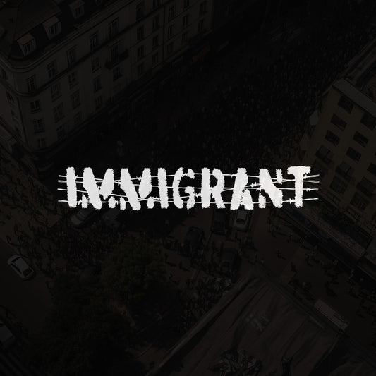Aerial view of a city street with NAVIGHTAT overlay, showcasing the Immigrant Shirt featuring barbed wire stencil design, symbolizing resilience and unity for justice and equality.