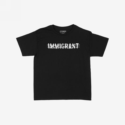 Immigrant Women's Baby Tee featuring distressed white IMMIGRANT text with slash marks on black fabric, symbolizing strength and activism. Designed for women advocating for immigrant rights, merging style with solidarity.