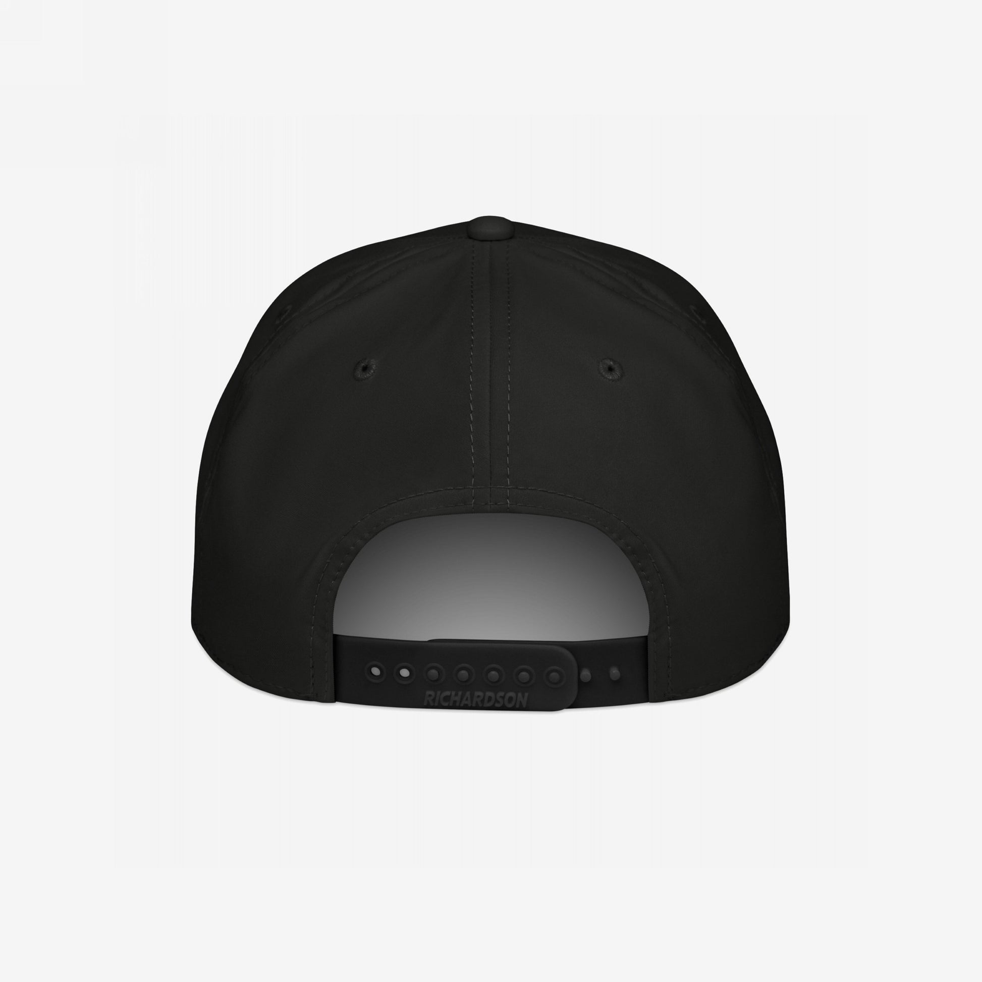 Back view of the Immigrant Hat, a black six-panel snapback with RICHARDSON on the adjustable strap. Features small ventilation eyelets and embodies rebellion with its bold stenciled barbed wire design.