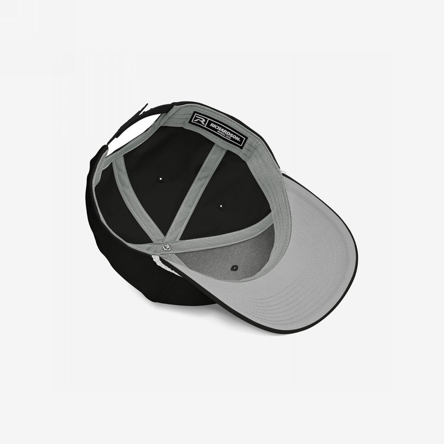 The Immigrant Hat reveals its inner structure with a grey underbill, sweatband, support panels, and adjustable strap, embodying rebellion with a bold barbed wire design for those challenging fascism.