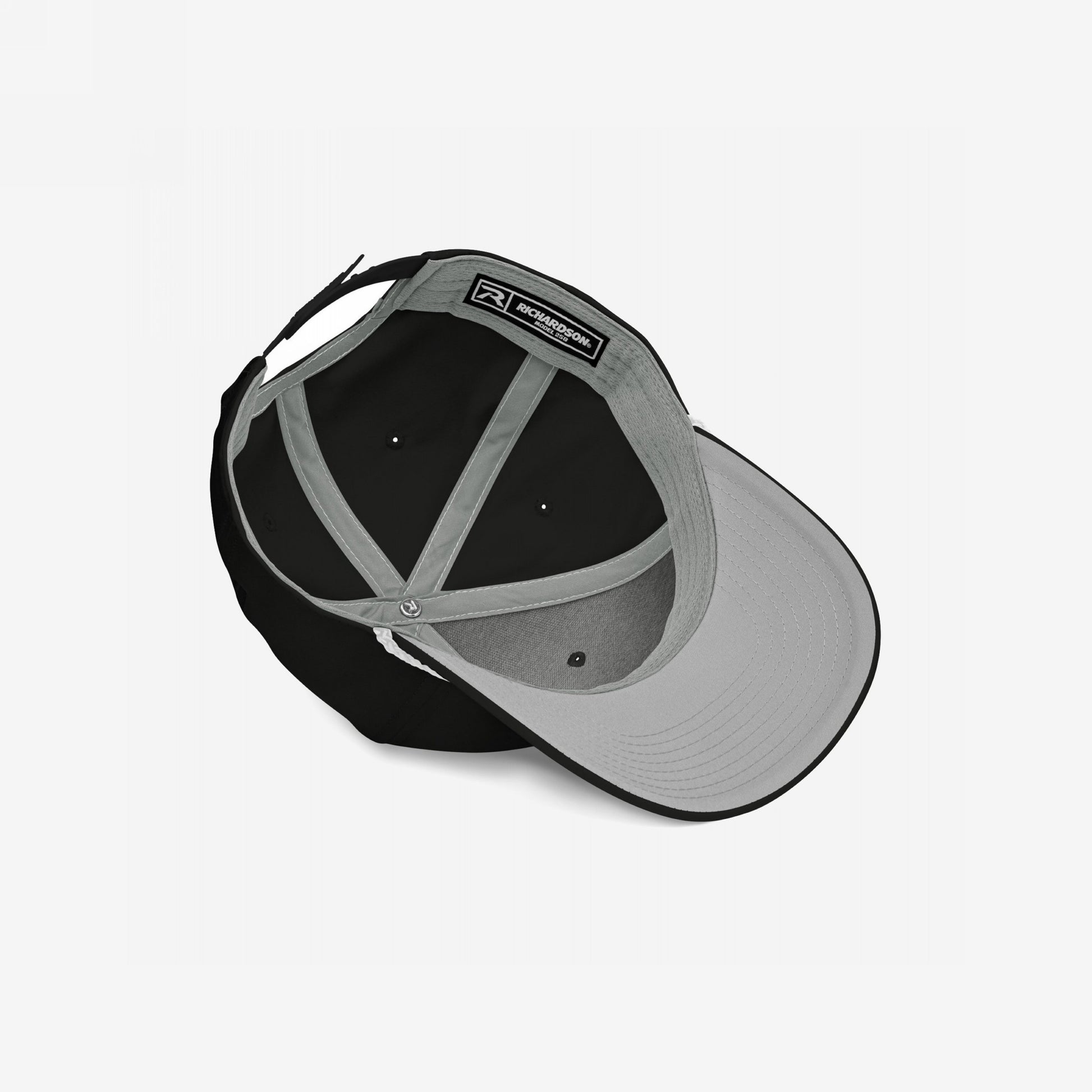 The Immigrant Hat reveals its inner structure with a grey underbill, sweatband, support panels, and adjustable strap, embodying rebellion with a bold barbed wire design for those challenging fascism.