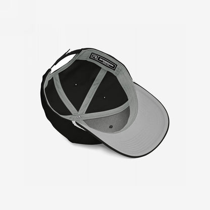 The Immigrant Hat reveals its inner structure with a grey underbill, sweatband, support panels, and adjustable strap, embodying rebellion with a bold barbed wire design for those challenging fascism.