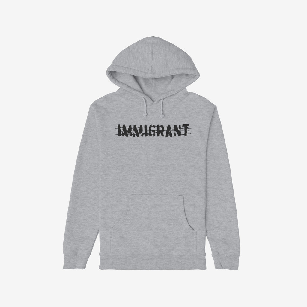 Immigrant Hoodie features a light-gray design with a front kangaroo pocket, adorned with IMMIGRANT in distressed, stenciled black font, symbolizing resistance and solidarity with immigrant communities.