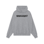 Immigrant Hoodie features a light-gray design with a front kangaroo pocket, adorned with IMMIGRANT in distressed, stenciled b