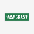 Aerial view of a street scene with a green banner reading IMMIGRANT in white, jagged letters over barbed-wire graphics. Immigrant Sticker & Magnet symbolizes unity and resilience against anti-immigrant sentiment.