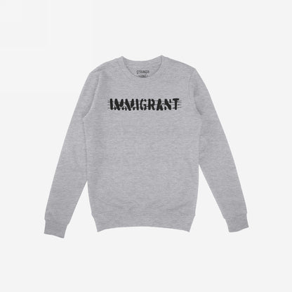 Light-gray, long-sleeved crewneck sweatshirt with IMMIGRANT in stencil-style across the chest, reflecting resilience and solidarity. Part of the Immigrant Shirt collection, representing strength and unity against injustice.