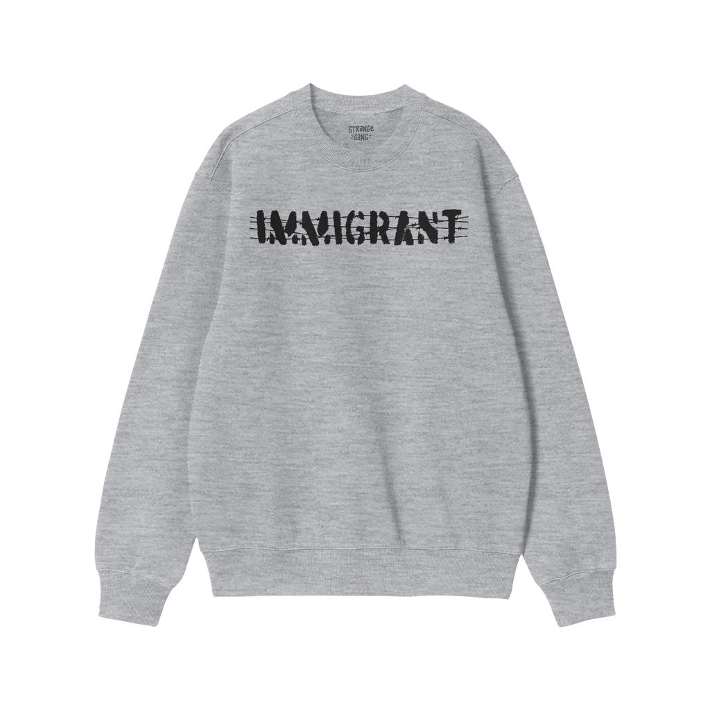 Light-grey Immigrant Hoodie & Sweatshirt features bold, distressed IMMIGRANT lettering with slash-through style, embodying ac