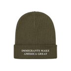 Immigrants Make America Great Hat: Olive-green knit beanie with a folded cuff, featuring white embroidered message advocating