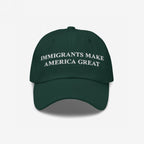 Immigrants Make America Great Hat featuring bold white embroidery on a six-panel cap, symbolizing support for immigrant communities. Perfect for daily wear or protests, aligning with values of equality and anti-racism.