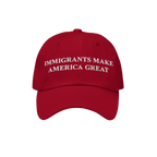 Red baseball-style cap featuring white embroidered text: IMMIGRANTS MAKE AMERICA GREAT. This statement piece supports immigra