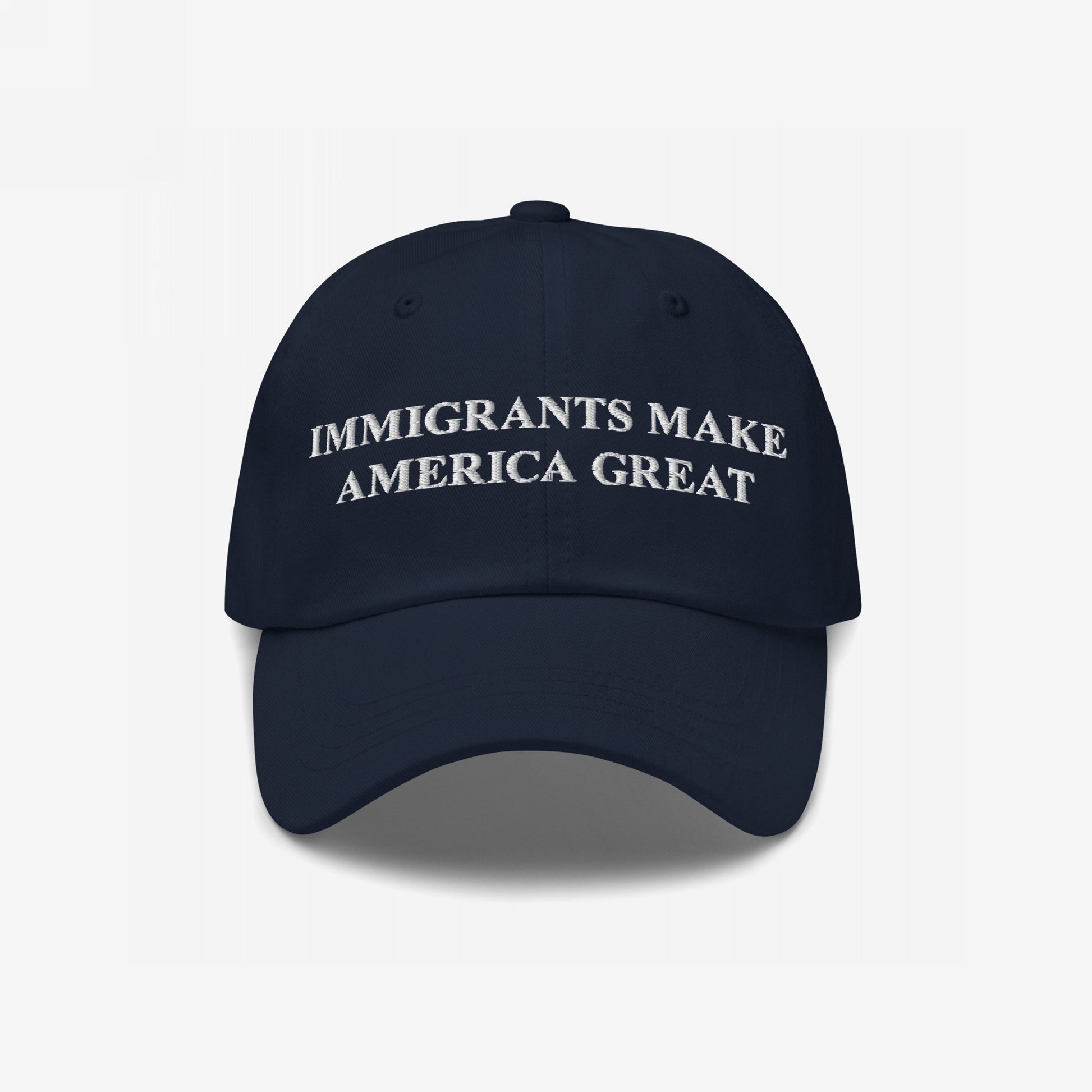 Navy-blue Immigrants Make America Great hat with bold white embroidery, embodying a strong message supporting immigrant rights and equality, suitable for rallies or daily wear.