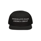 The Immigrants Make America Great Hat features bold white embroidery on a black snapback, symbolizing solidarity and advocacy