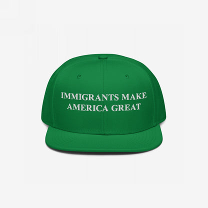 Bright green flat-bill baseball cap with bold white embroidery, reading IMMIGRANTS MAKE AMERICA GREAT, symbolizes resilience and advocacy for immigrant rights.