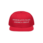 Immigrants Make America Great Hat featuring bold white embroidery on a flat-brimmed cap, symbolizing solidarity and advocacy 