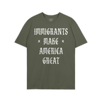 Plain green T-shirt with bold white slogan IMMIGRANTS × MAKE × AMERICA GREAT in Old English style, symbolizing protest and 