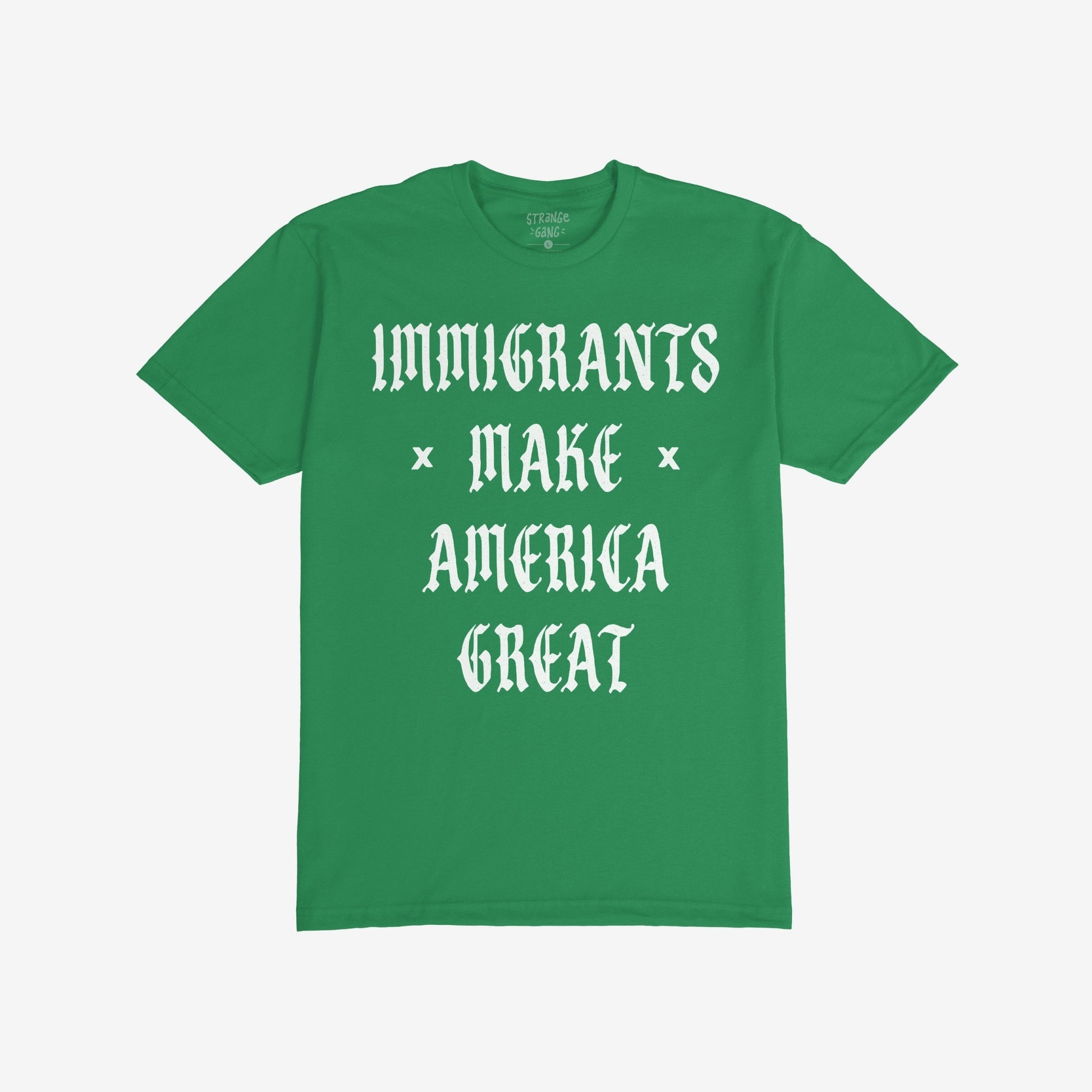 Immigrants Make America Great T-shirt featuring bold white Old English-style font, celebrates immigrant contributions and opposes xenophobia. The slogan is printed on the front of a plain green shirt.