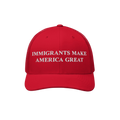 Immigrants Make America Great Hat features bold white embroidery on a red trucker cap, symbolizing solidarity with immigrant 