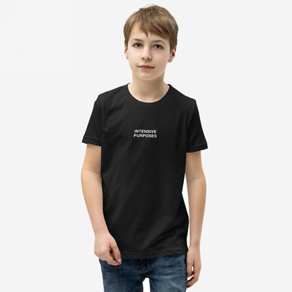 Young boy wearing the Intensive Purposes T-shirt, featuring the phrase INTENSIVE PURPOSES in white text on a black background, styled humorously for grammar enthusiasts and those who embrace linguistic quirks.