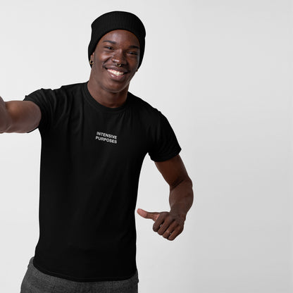 Young man models the Intensive Purposes T-shirt with INTENSIVE PURPOSES text, smiling confidently. A playful nod to linguistic quirks, ideal for those embracing grammatical chaos.