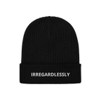The Irregardlessly Hat features a black rib-knit cuffed beanie with IRREGARDLESSLY embroidered in white, embodying a playful 