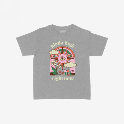 The Kinda High Women's Baby Tee features a retro graphic with a sun, rainbow, clouds, and mushrooms, embodying playful vibes. The phrases kinda high and right now accompany the art.
