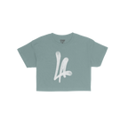 LA Handstyle Women's Baby Tee in medium blue features a bold white LA spray-paint graphic on the chest, capturing a retro Y2K